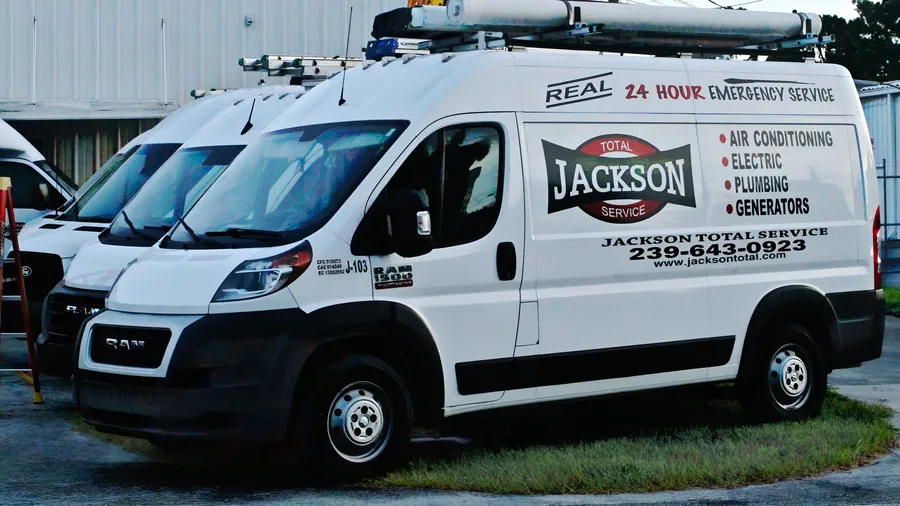 Jackson Total Service van lettered for air conditioning, electric, plumbing and generators